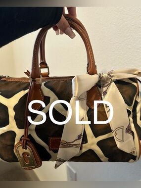 SOLD! 
Dooney & Bourke Brown and Cream Giraffe-Print Purse